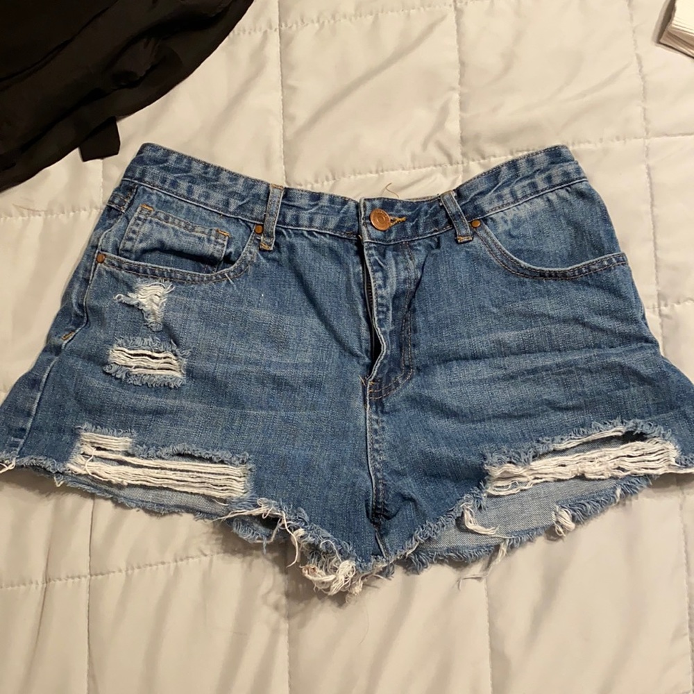 blue jean shorts, with rips.